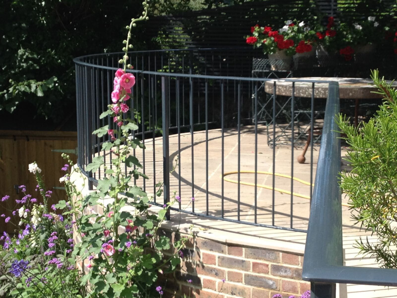 Curved mild steel garden handrail, galvanised and powder coated