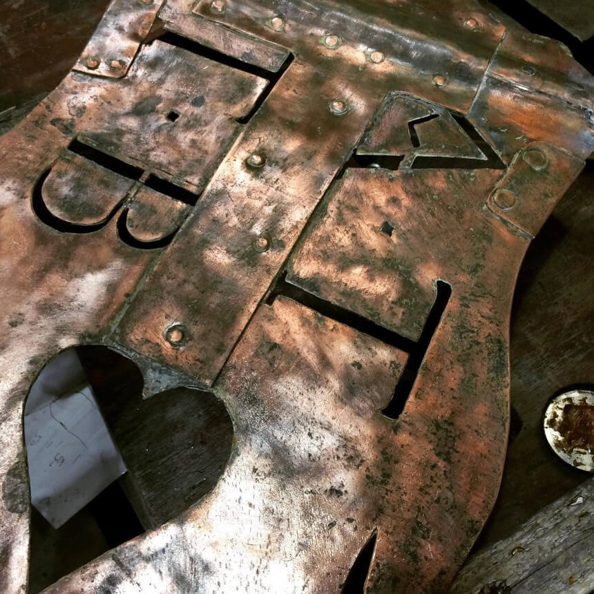 Cut copper sign with patinated finish, lettering and a heart shaped cut out