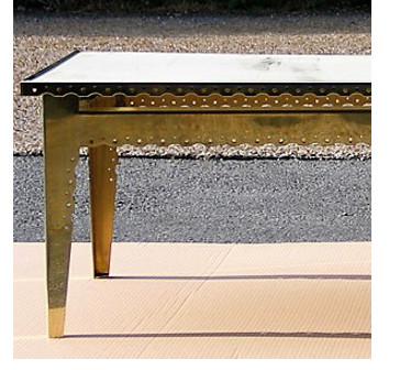 Perforated ornate brass cabinet frame